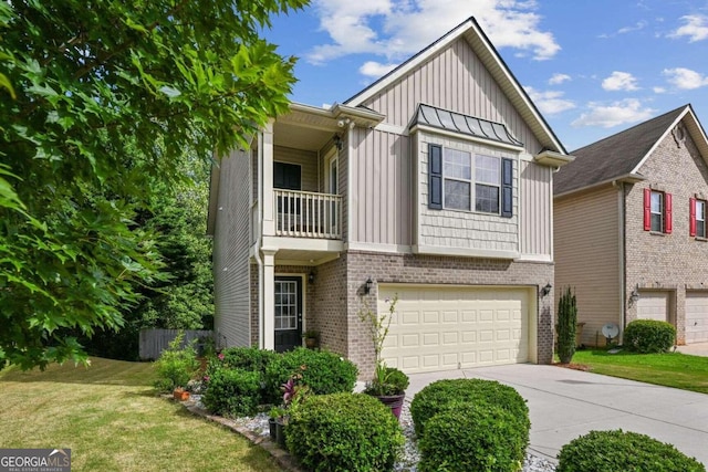 view of front of property featuring a front yard, a balcony, and a garage