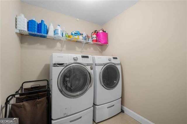 clothes washing area with independent washer and dryer