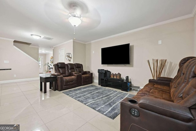 living room featuring ornamental molding, ceiling fan, and light tile patterned floors