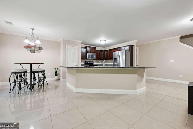 kitchen featuring dark stone countertops, stainless steel appliances, dark brown cabinets, ornamental molding, and a chandelier