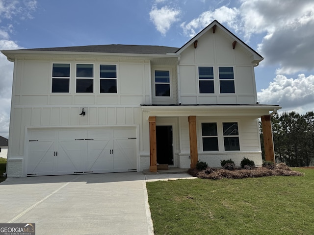 713 Windstream Dr Unit B58, Lagrange, GA 30241 - view of front of property with a front lawn, concrete driveway, an attached garage, brick siding, and board and batten siding