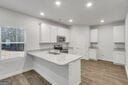 713 Windstream Dr Unit B58, Lagrange, GA 30241 - kitchen with recessed lighting, light countertops, and white cabinets