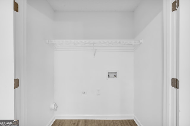 laundry room with hardwood / wood-style floors, washer hookup, and hookup for an electric dryer