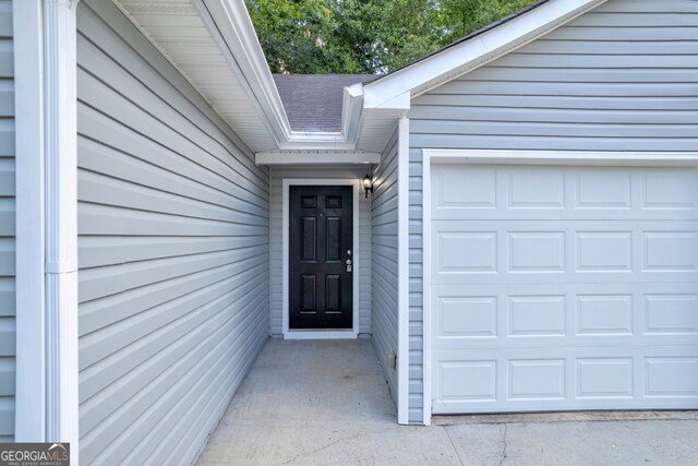 property entrance with a garage