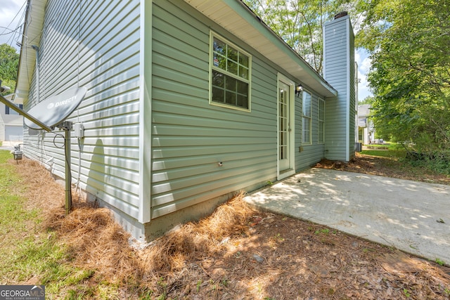 view of property exterior featuring a patio area