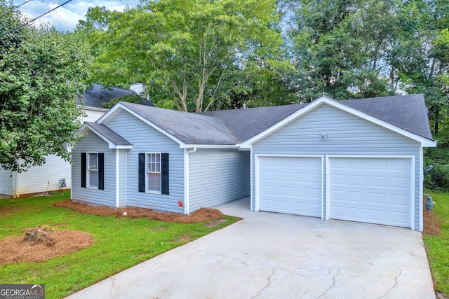 single story home featuring a garage and a front yard