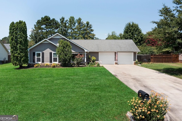 ranch-style home with driveway, an attached garage, a front yard, and fence