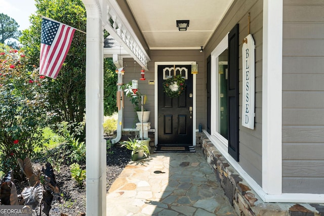 entrance to property featuring covered porch