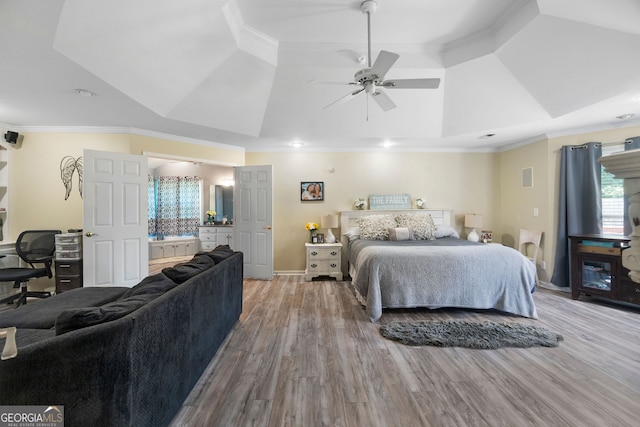 bedroom featuring ornamental molding, light hardwood / wood-style flooring, and ceiling fan