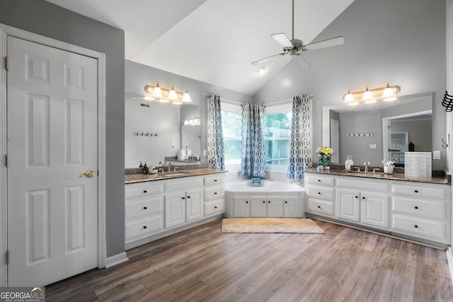 full bathroom with wood finished floors, ceiling fan, and a sink