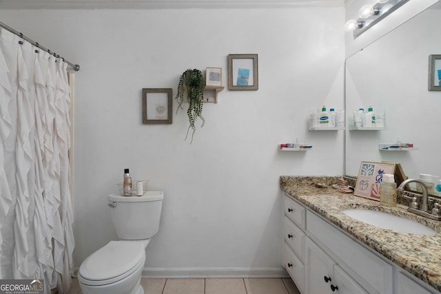 bathroom featuring a shower with curtain, toilet, vanity, tile patterned flooring, and baseboards