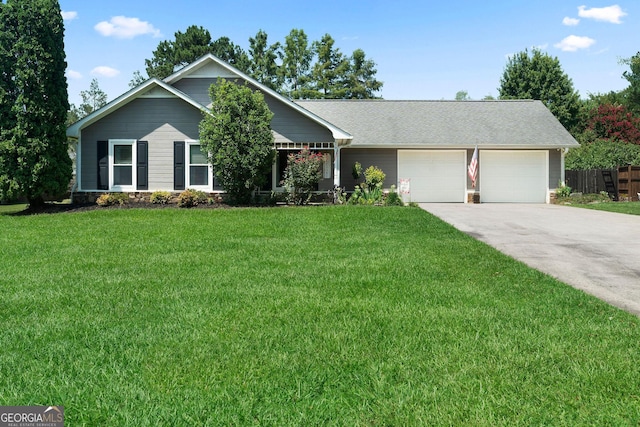 single story home featuring a garage, driveway, a front yard, and fence