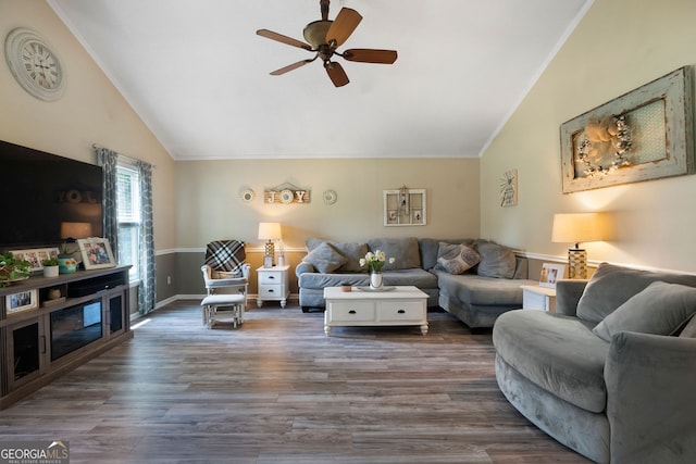 living room with lofted ceiling, dark hardwood / wood-style floors, crown molding, and ceiling fan