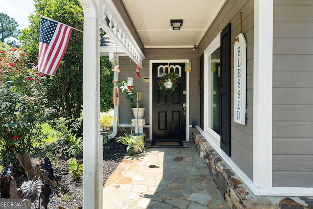 property entrance with covered porch