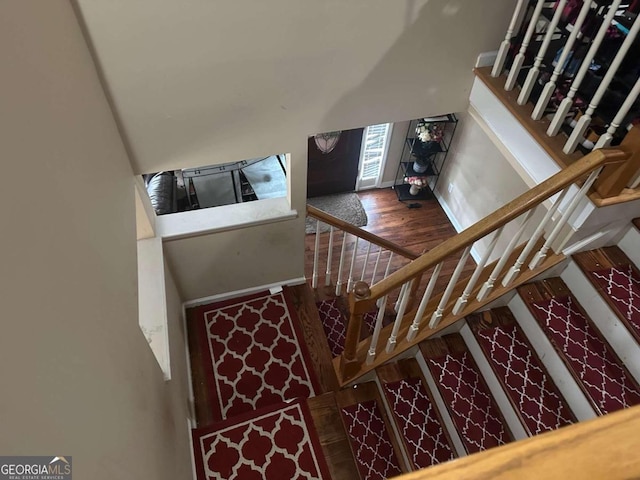 stairs with wood-type flooring