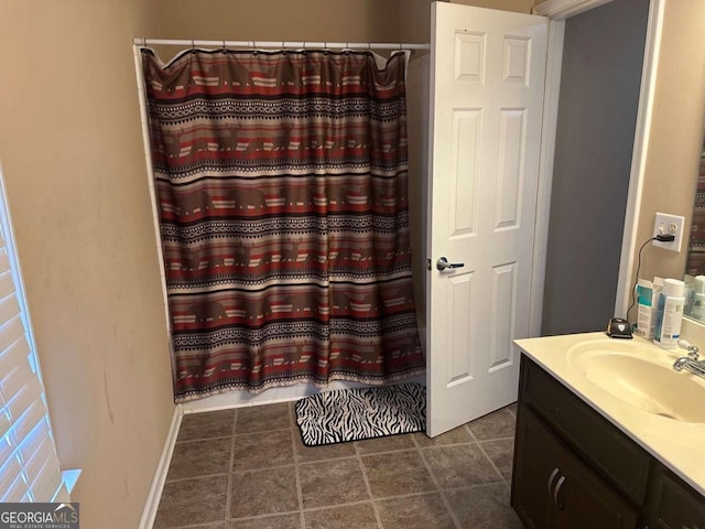 bathroom with vanity, tile patterned flooring, and curtained shower