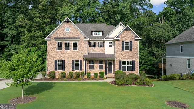 craftsman-style home featuring a front yard