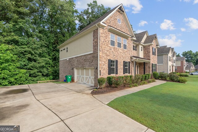 exterior space with a yard and a garage