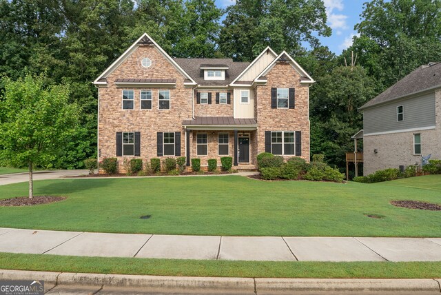 craftsman house featuring a front yard