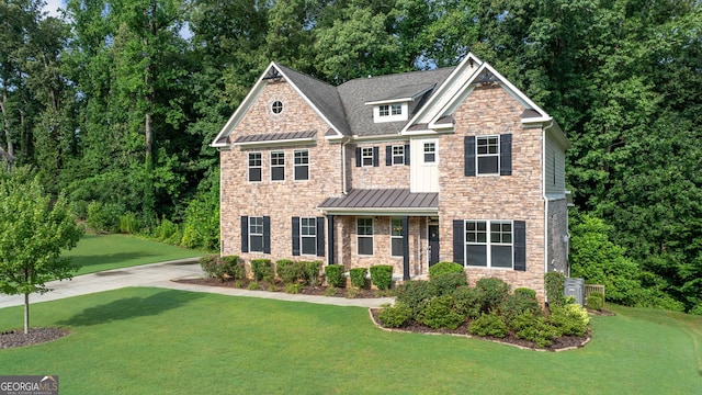 craftsman-style home with a front yard