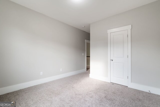 unfurnished bedroom featuring carpet flooring