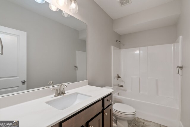 full bathroom with  shower combination, toilet, tile patterned floors, and vanity