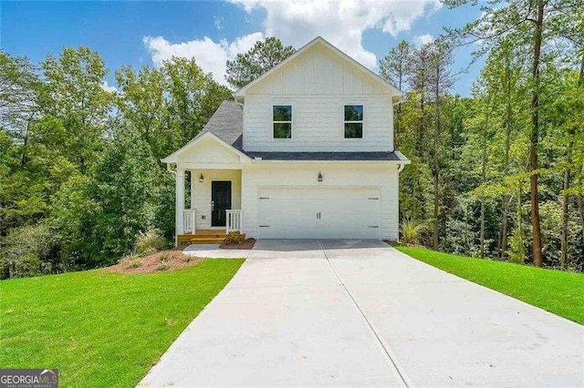 view of front of house featuring a front lawn and a garage