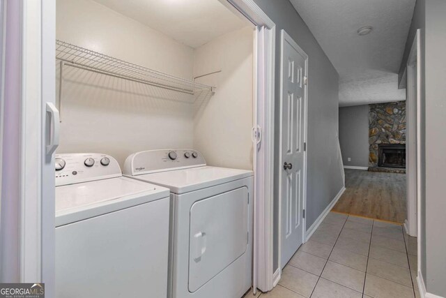 2498 Hidden Cove Ct Unit D, Gainesville, GA 30501 - unfurnished living room with a textured ceiling, wood finished floors, a fireplace, and french doors