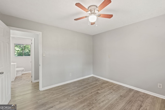 empty room featuring light hardwood / wood-style floors and ceiling fan