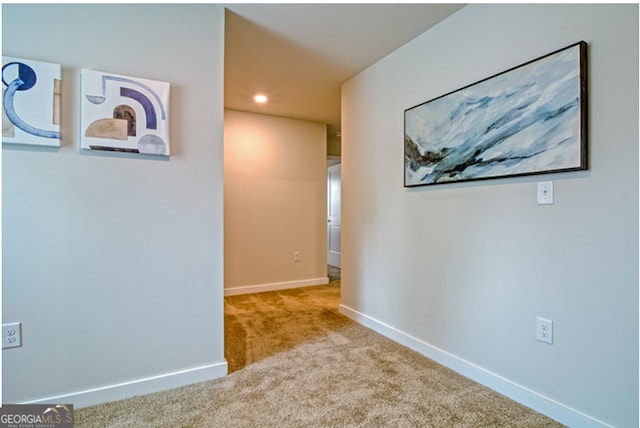 corridor with light colored carpet