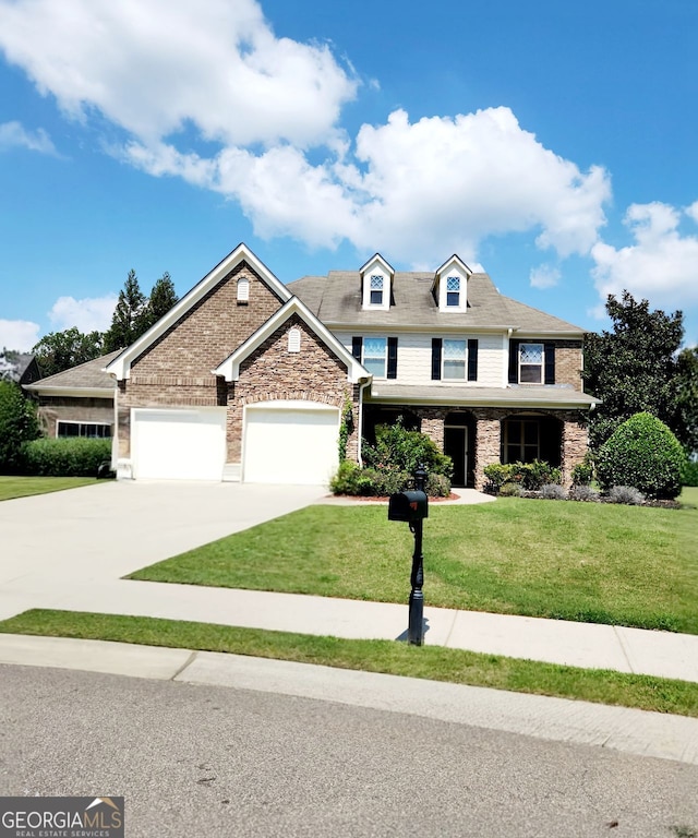 craftsman-style house featuring a garage and a front lawn