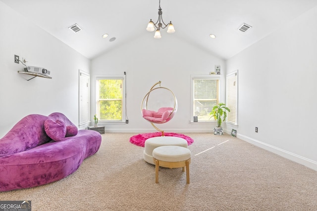 interior space with carpet flooring, high vaulted ceiling, and a chandelier