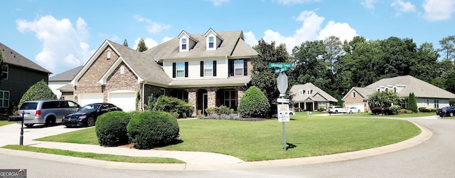 view of front of home with a garage and a front yard