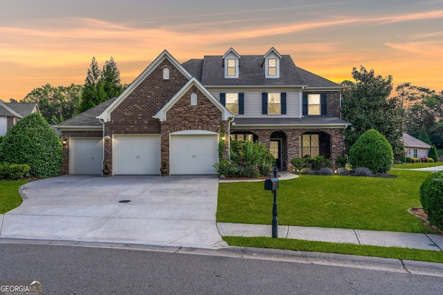 view of front of house with a lawn and a garage