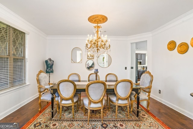 dining room with a notable chandelier, hardwood / wood-style floors, and ornamental molding