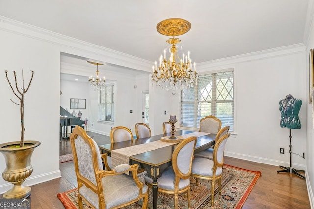 dining room featuring a notable chandelier, dark wood-type flooring, and ornamental molding