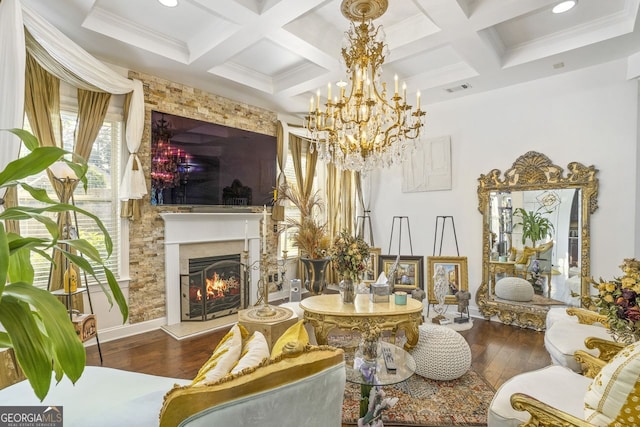 living room with beam ceiling, a chandelier, wood-type flooring, and coffered ceiling