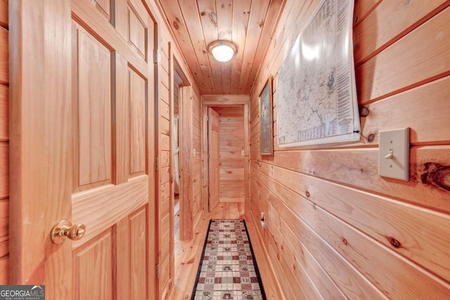 interior space featuring wood walls and wood ceiling