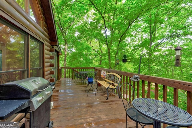 wooden terrace featuring grilling area