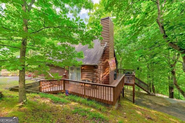 exterior space featuring a wooden deck