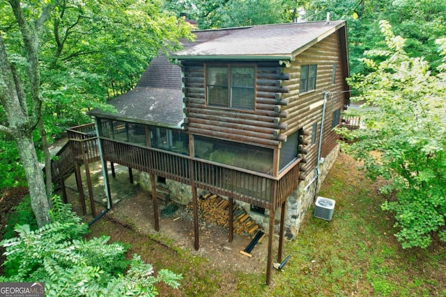 back of property featuring cooling unit and a deck