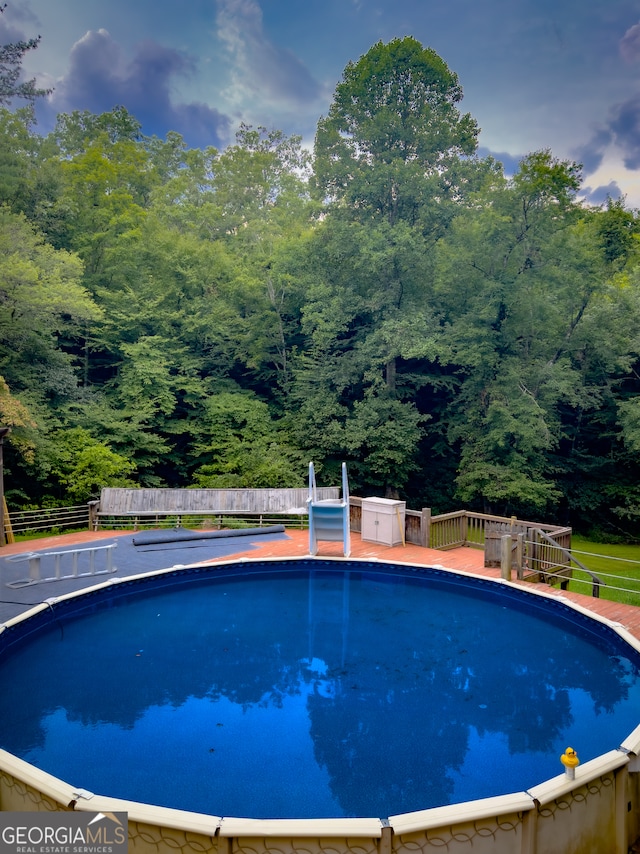 view of pool featuring a deck