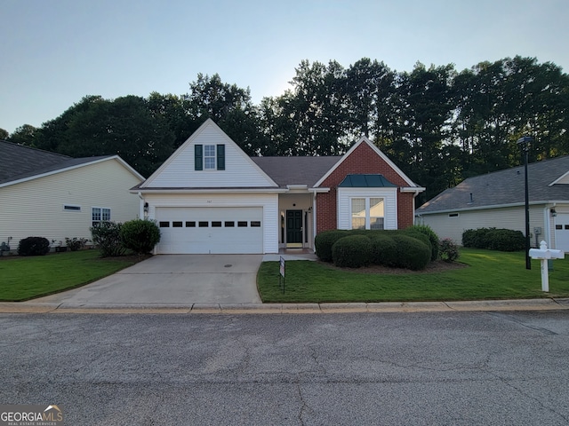 front of property featuring a front yard and a garage