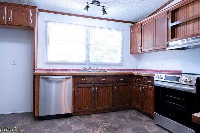 kitchen featuring sink, ornamental molding, a textured ceiling, appliances with stainless steel finishes, and extractor fan