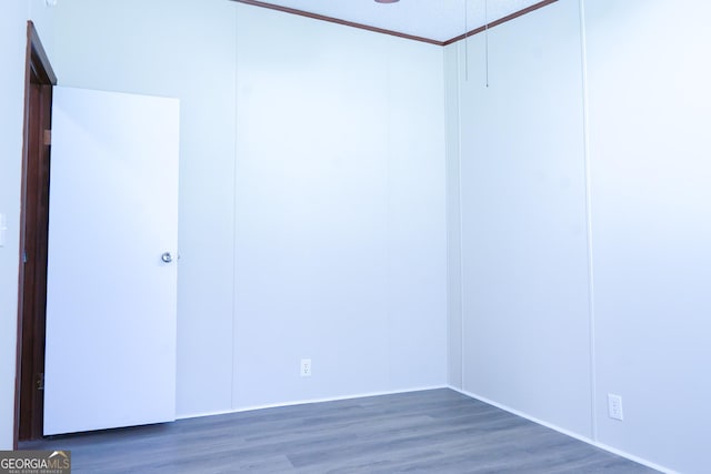 empty room featuring dark hardwood / wood-style flooring