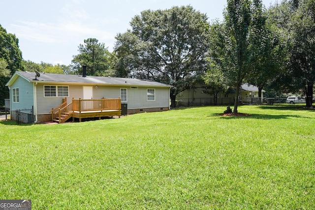 view of yard featuring a wooden deck