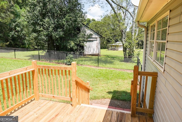 wooden deck with a lawn