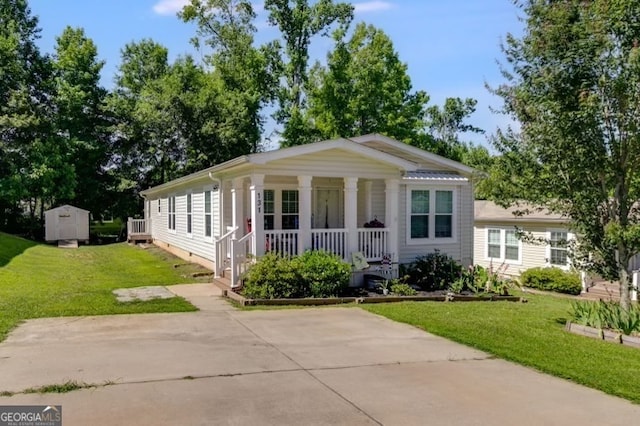 view of front facade featuring a front yard, a shed, and a porch