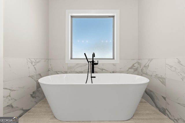 full bath featuring a soaking tub