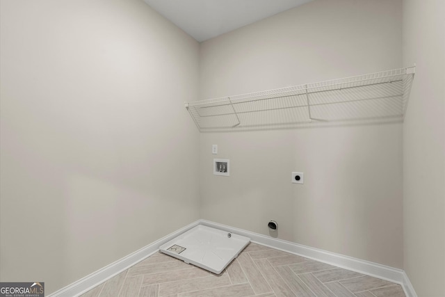 laundry room with laundry area, hookup for a washing machine, baseboards, and electric dryer hookup